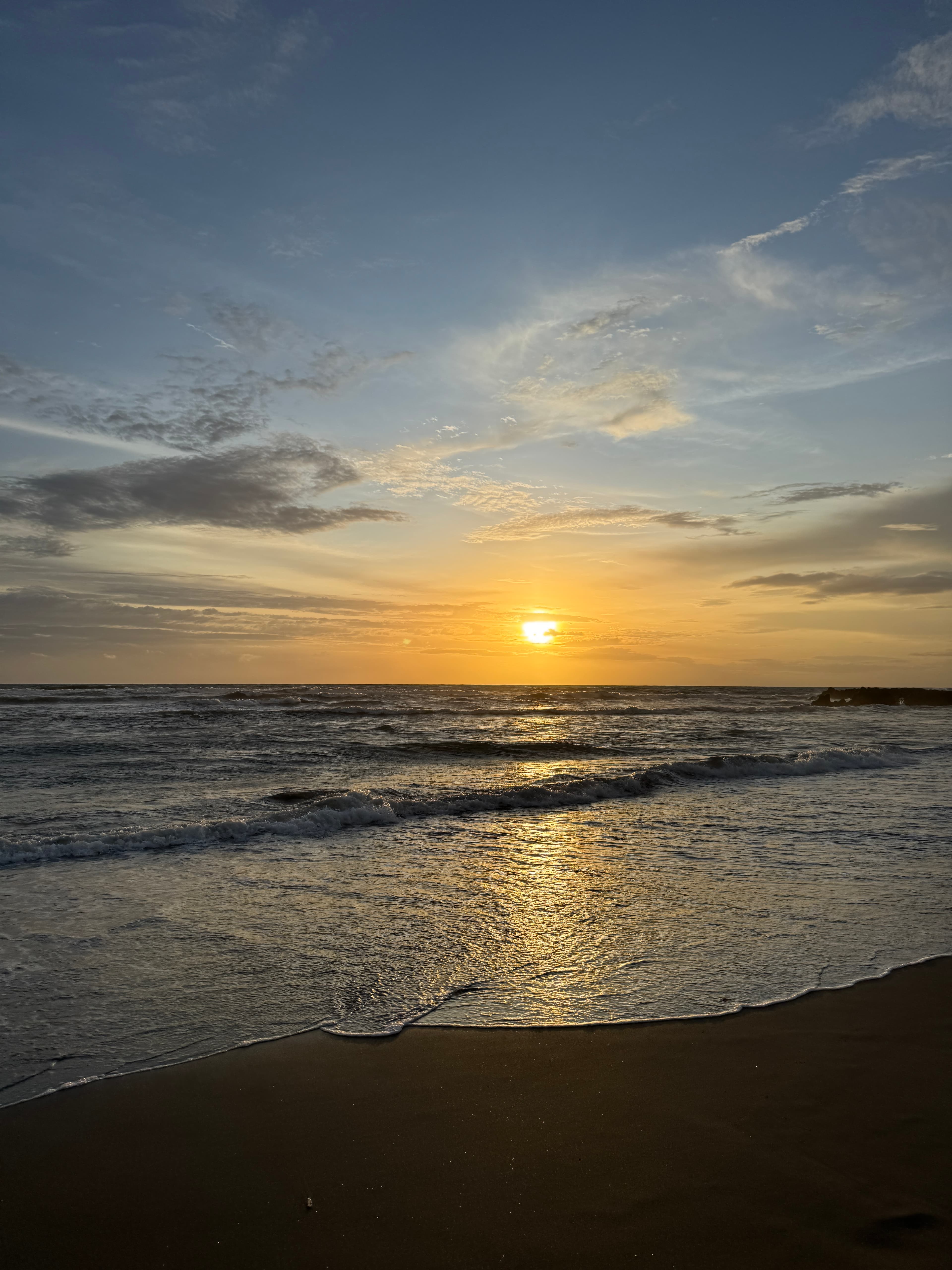 Oasis performing at Wembley Stadium, with a sea of fans in the background