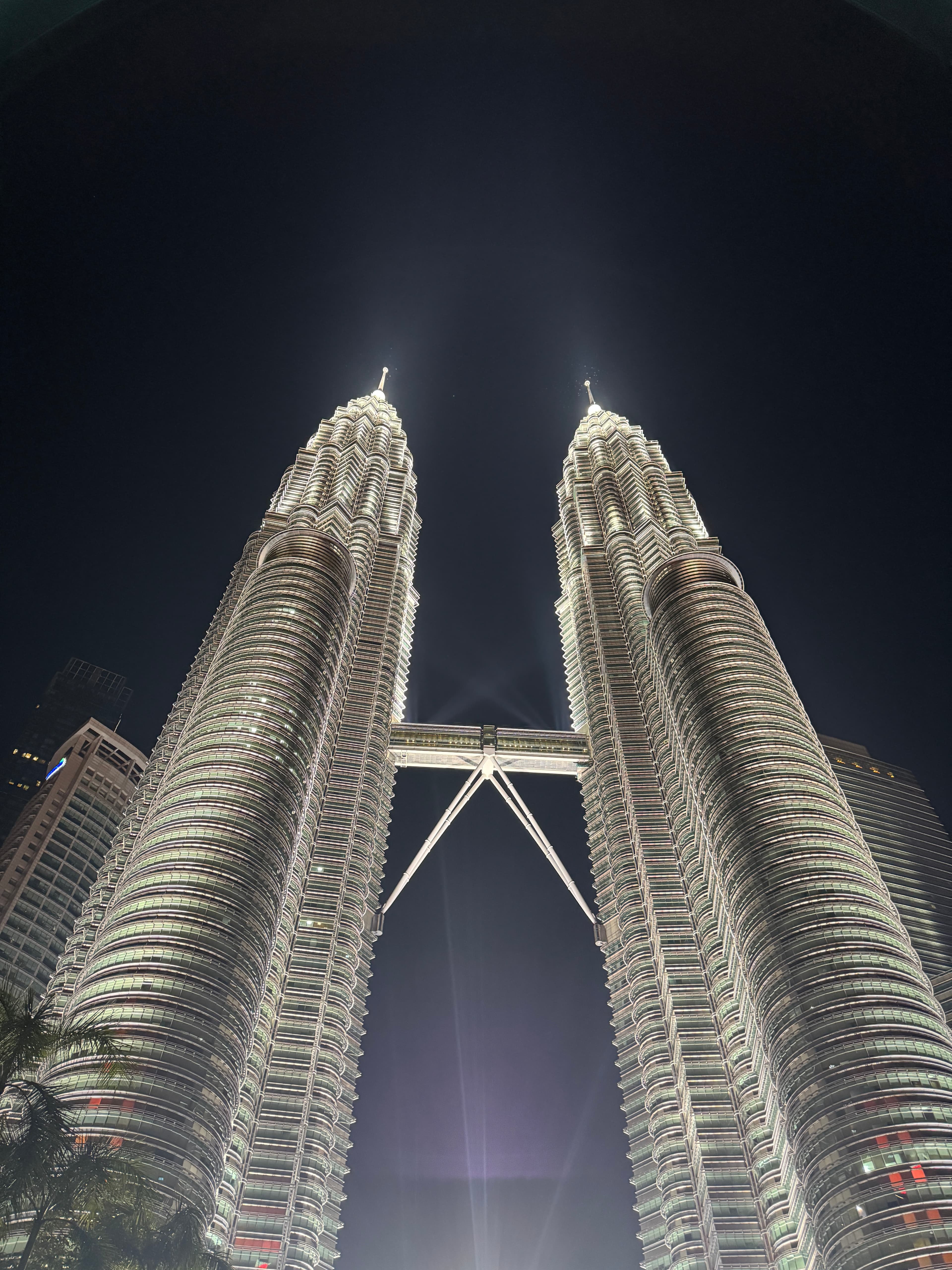 Oasis performing at Wembley Stadium, with a sea of fans in the background