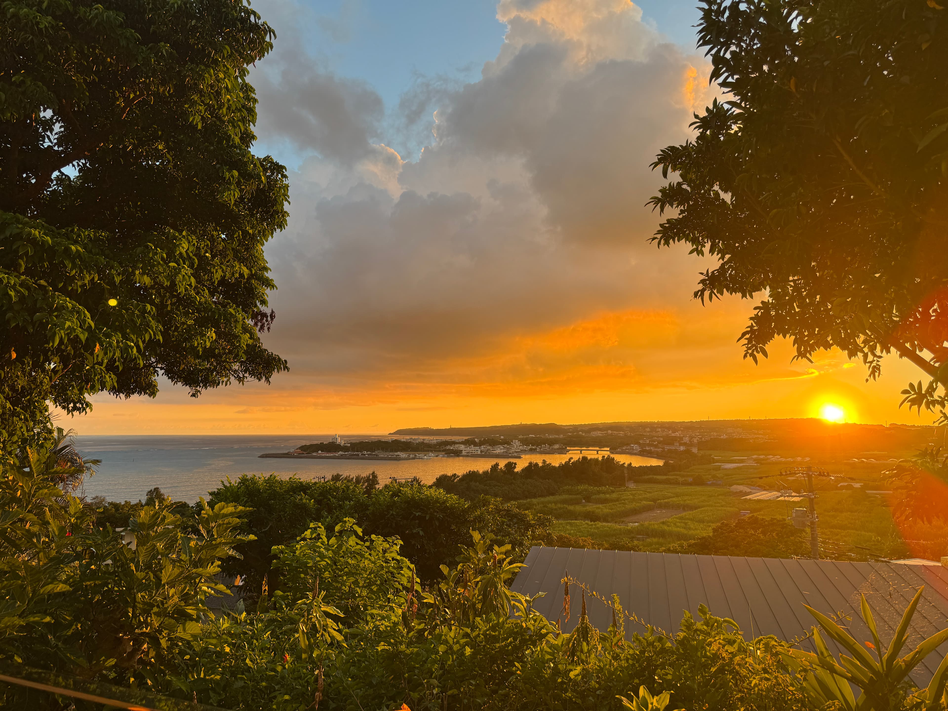Golden sunset over a coastal bay in Okinawa, captured from an amazing homestay